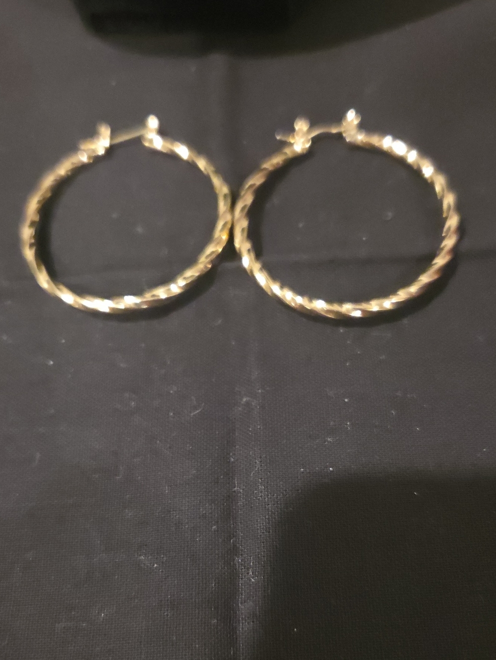 GOLDTONE TWISTED HOOP EARRING
